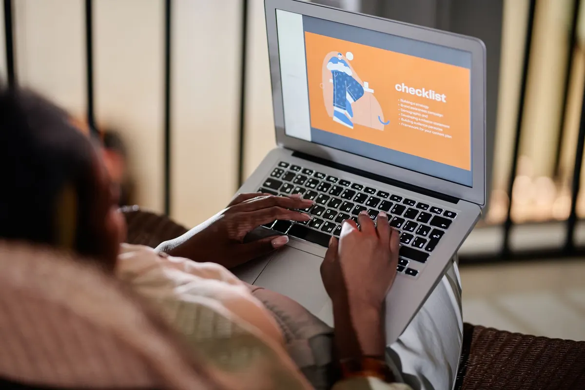Person working through a checklist on a laptop