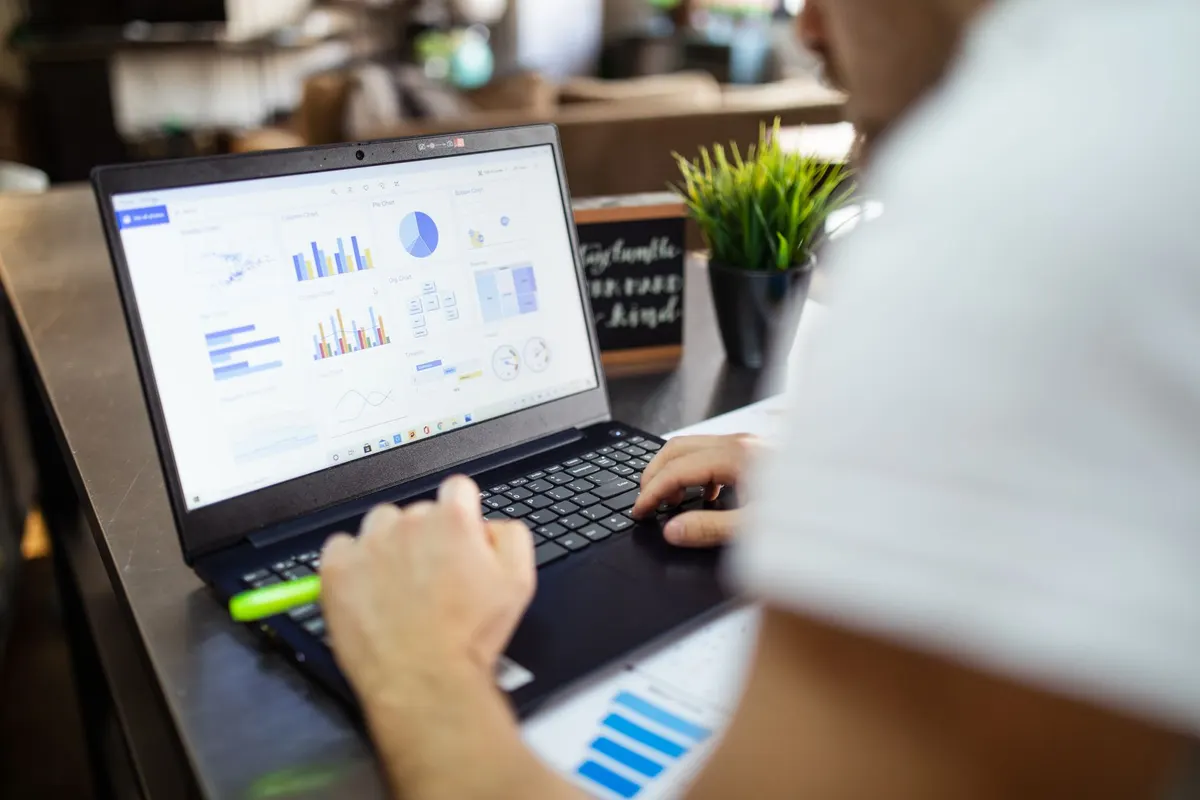 Laptop showing spreadsheet data analysis